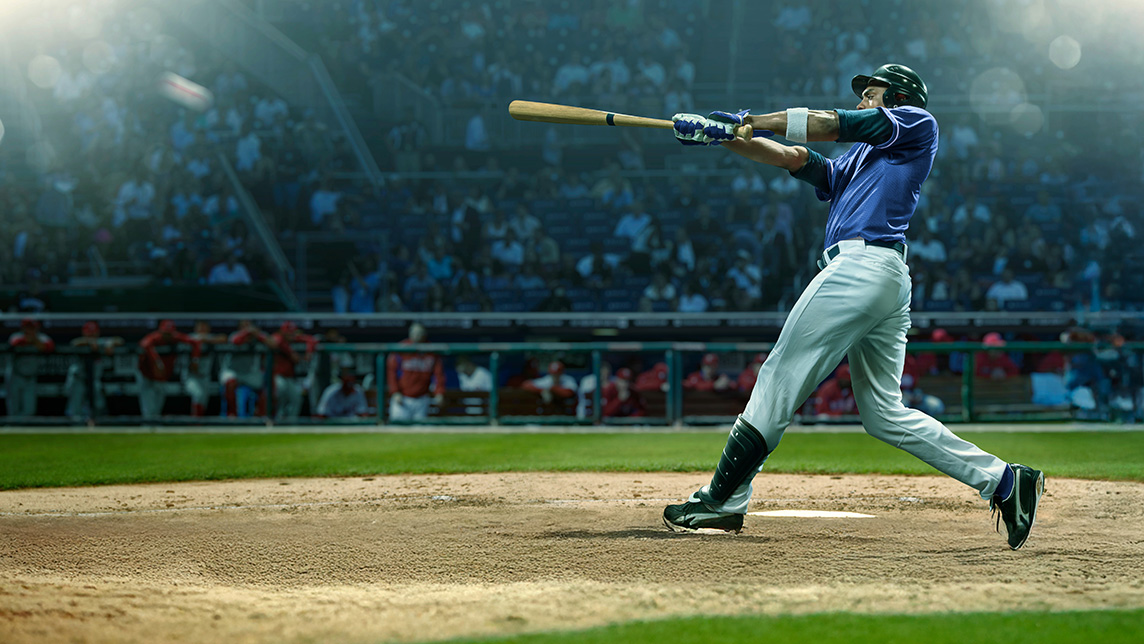 MLB player hitting ball with bat